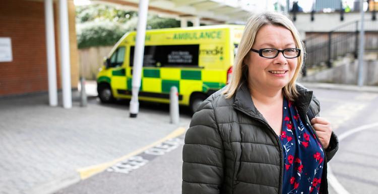 Lady infront of ambulance