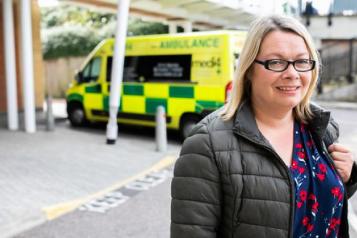 Lady infront of ambulance